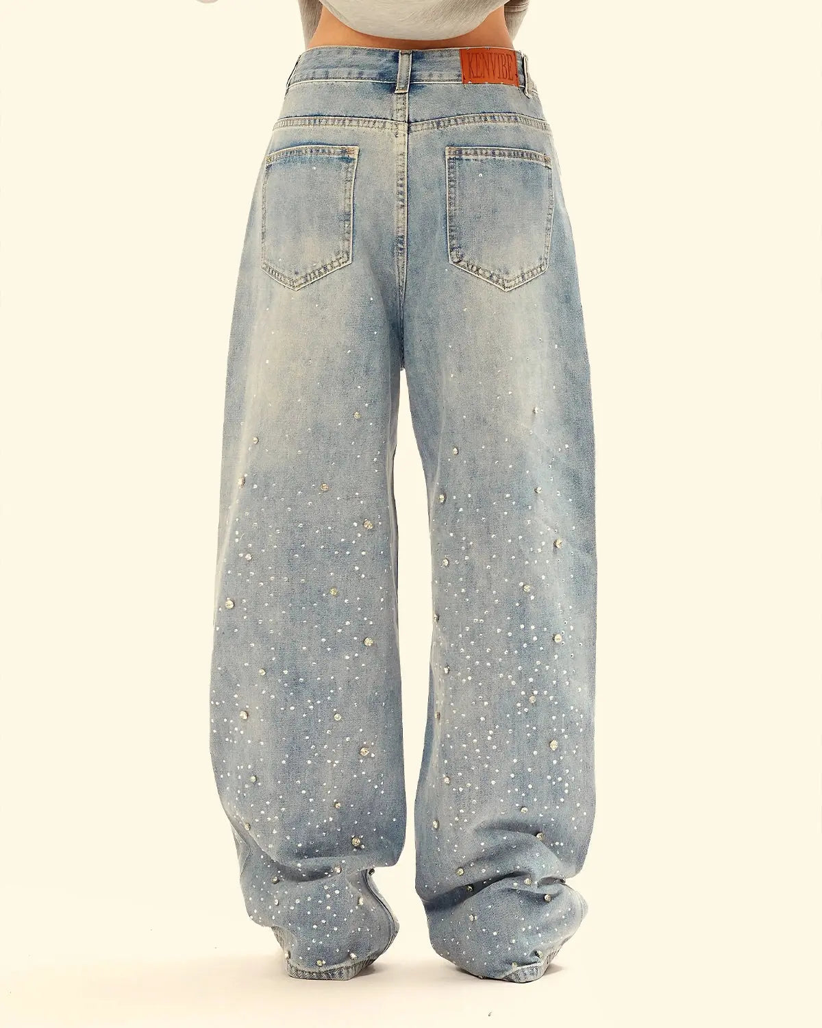 Inflation Streetwear studded rhinestone baggy jeans with embellishments and distressed details, casual streetwear style.