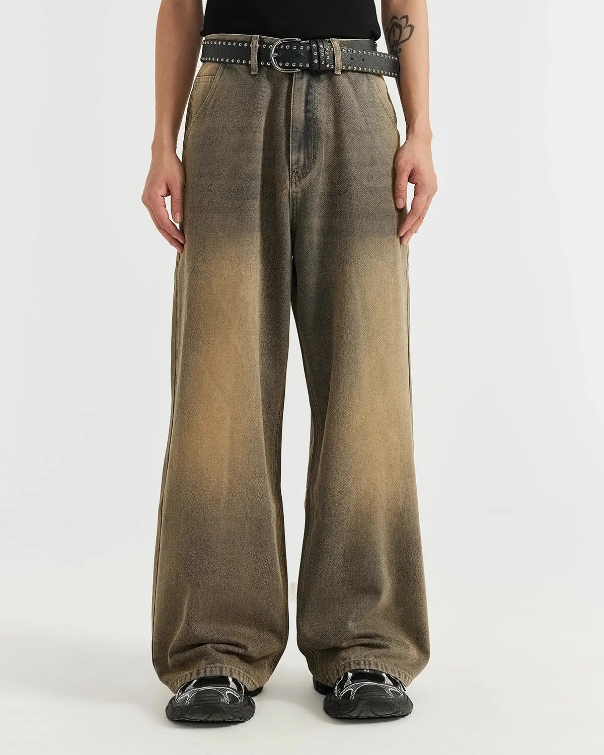 Brown acid wash baggy jeans from Inflation Streetwear, featuring a relaxed fit and distressed denim style.