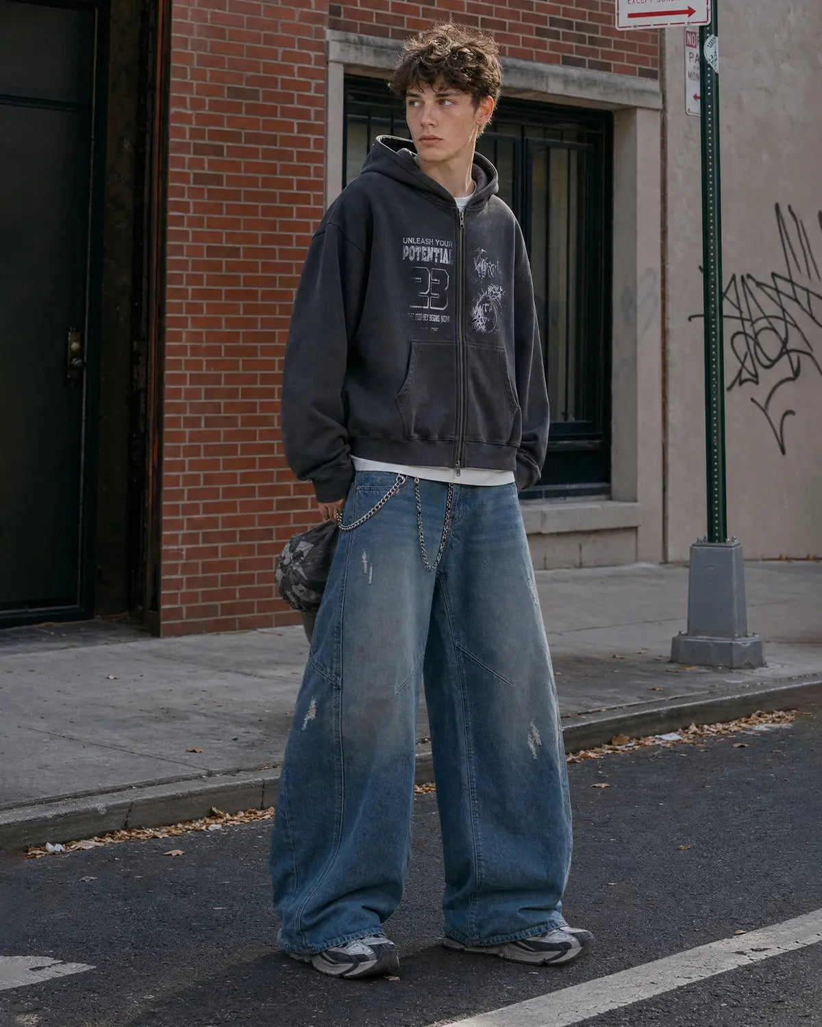 Inflation brand distressed ripped baggy jeans with a relaxed fit, featuring torn details and a casual streetwear style.