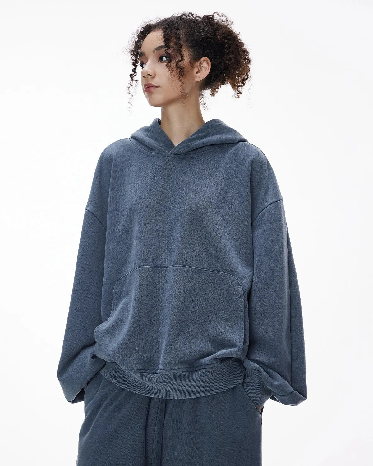 Inflation Streetwear garment washed French Terry hoodie with a relaxed fit, featuring a drawstring hood and soft, textured fabric.