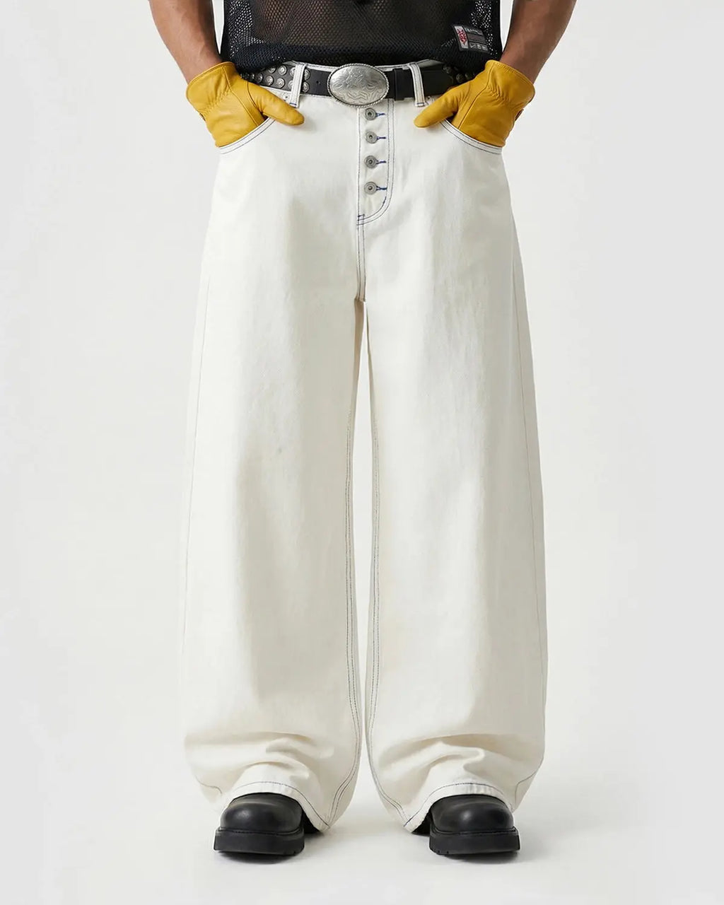 Inflation Contrast Stitch Baggy Jeans, casual pants with prominent stitching and relaxed fit, in dark denim fabric.