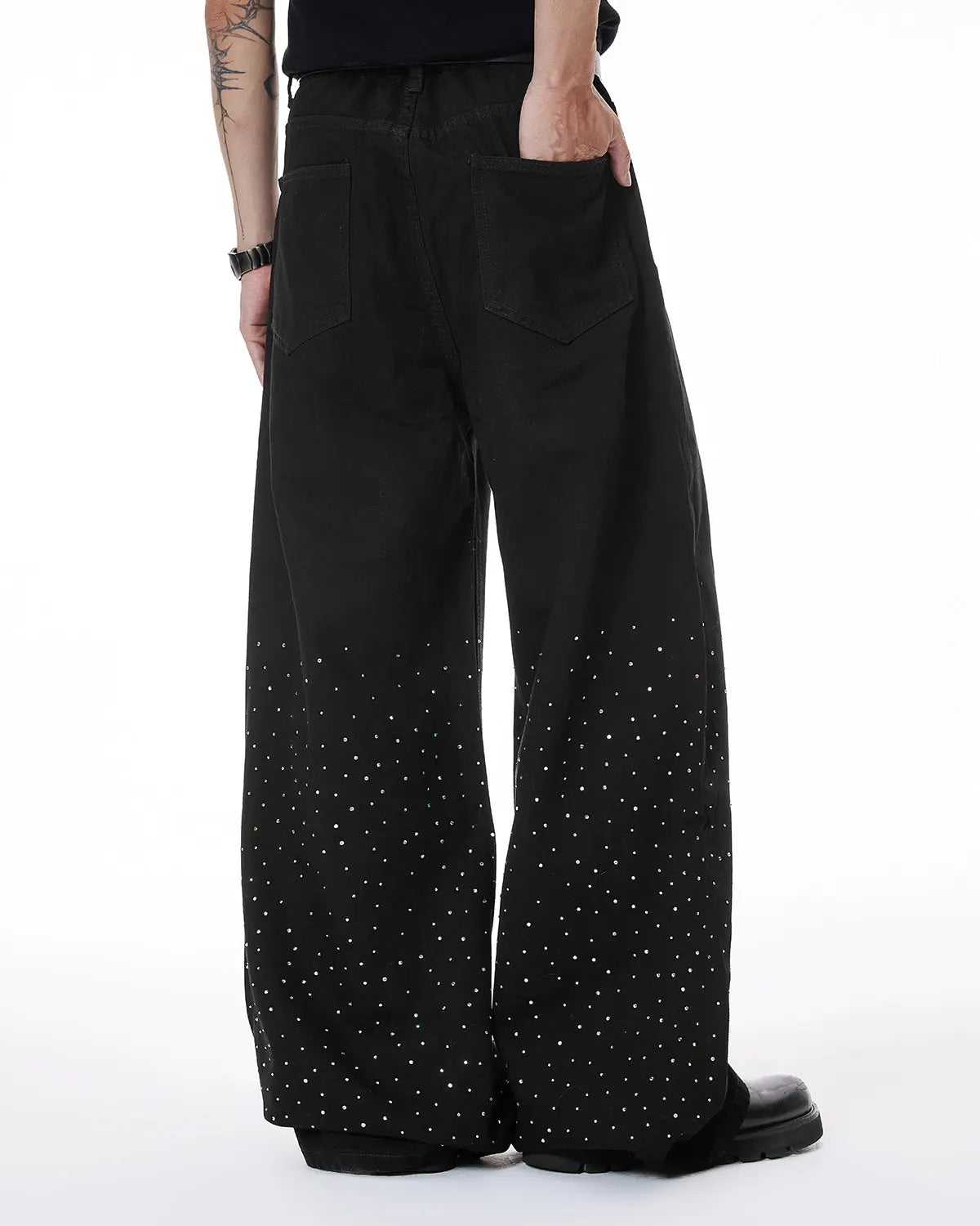 Inflation Chill wide-leg denim pants with rhinestone embellishments, casual streetwear style, shown on a model.