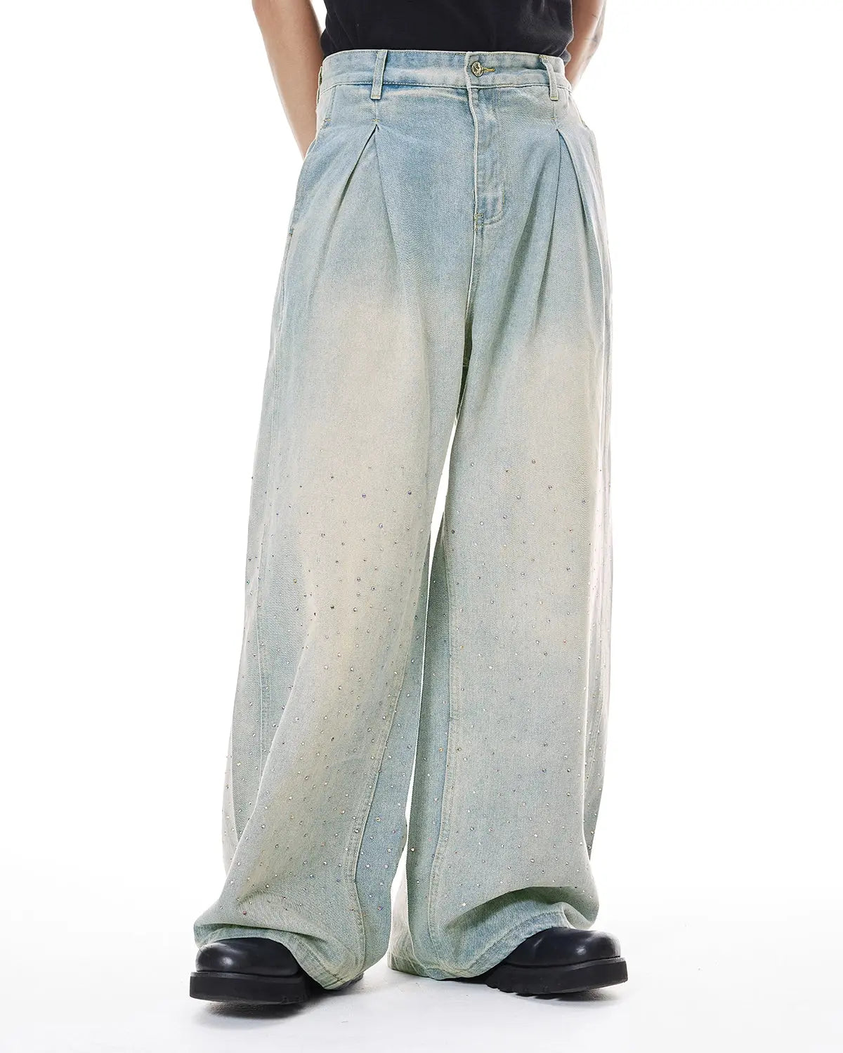 Washed rhinestone baggy jeans by INFLATION featuring a relaxed fit and rhinestone embellishments, shown on a model.