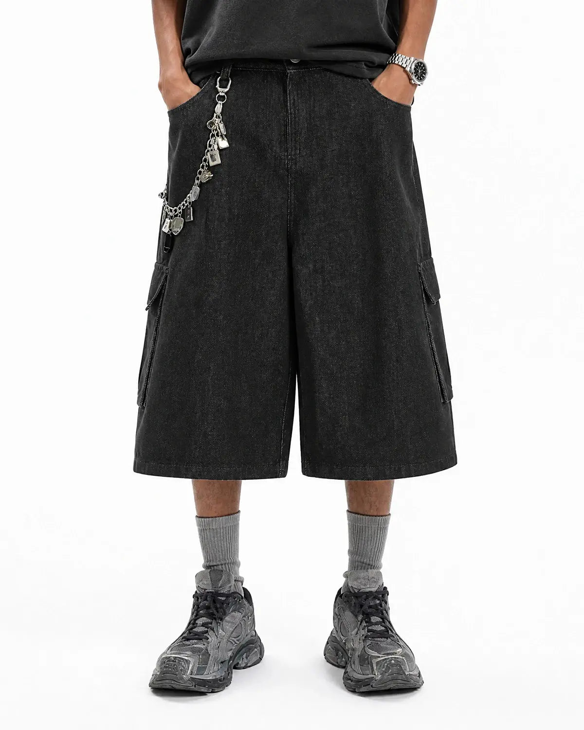Black cargo longline jorts by INFLATION Streetwear featuring a relaxed fit with multiple pockets and distressed details.