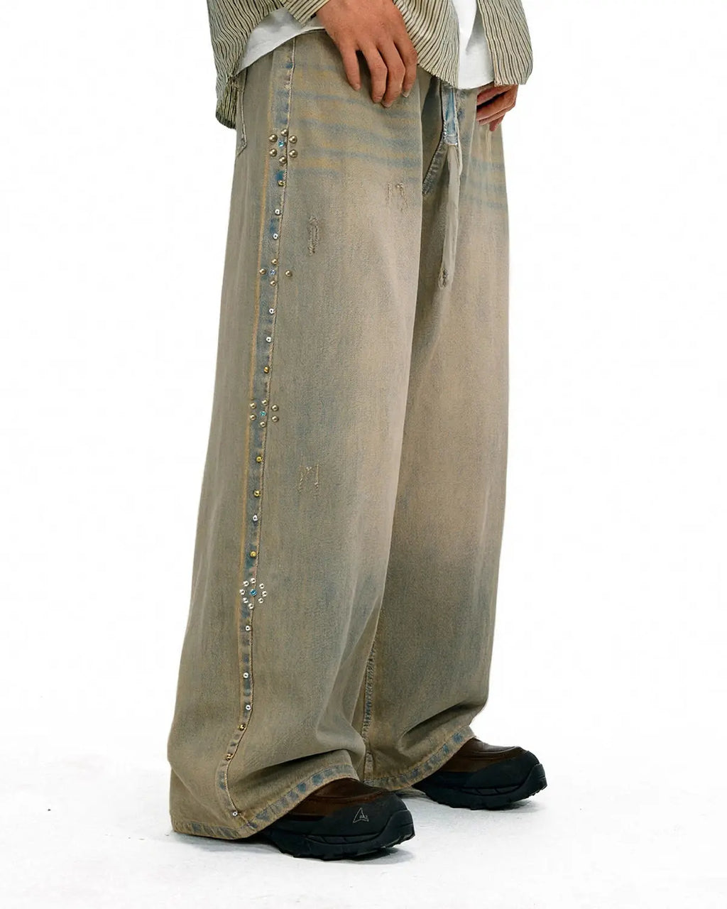 Beaded studded washed baggy jeans from INFLATION streetwear with distressed detailing and relaxed fit.