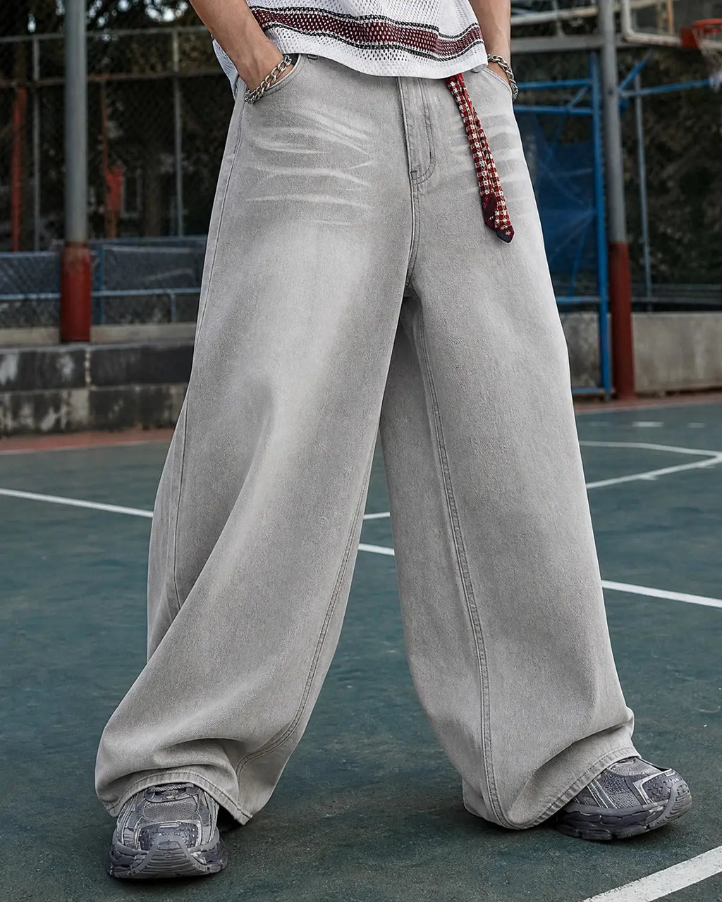 INFLATION Washed Distressed Baggy Jeans showing relaxed fit, ripped details, and distressed denim texture.