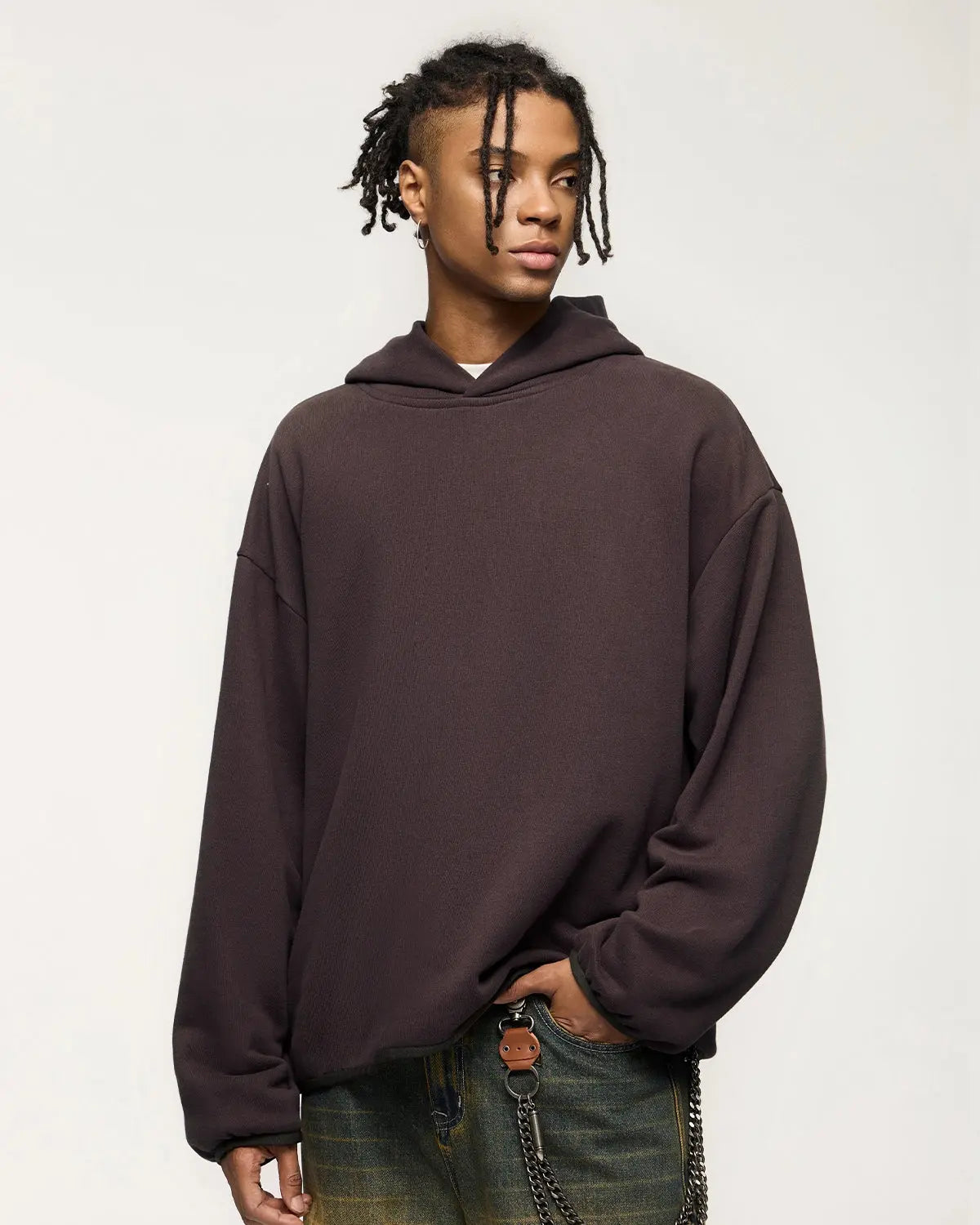 Black premium velvet hoodie by INFLATION streetwear, featuring a soft, plush fabric and a relaxed fit for casual comfort.