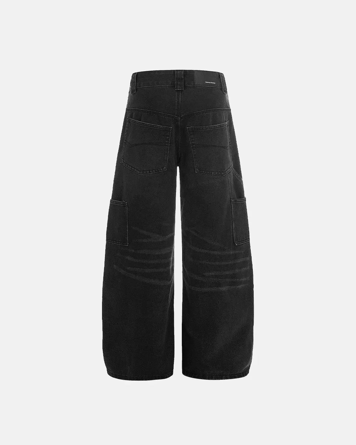 Black patchwork barrel jeans by INFLATION, featuring a relaxed fit, distressed details, and unique patchwork design.