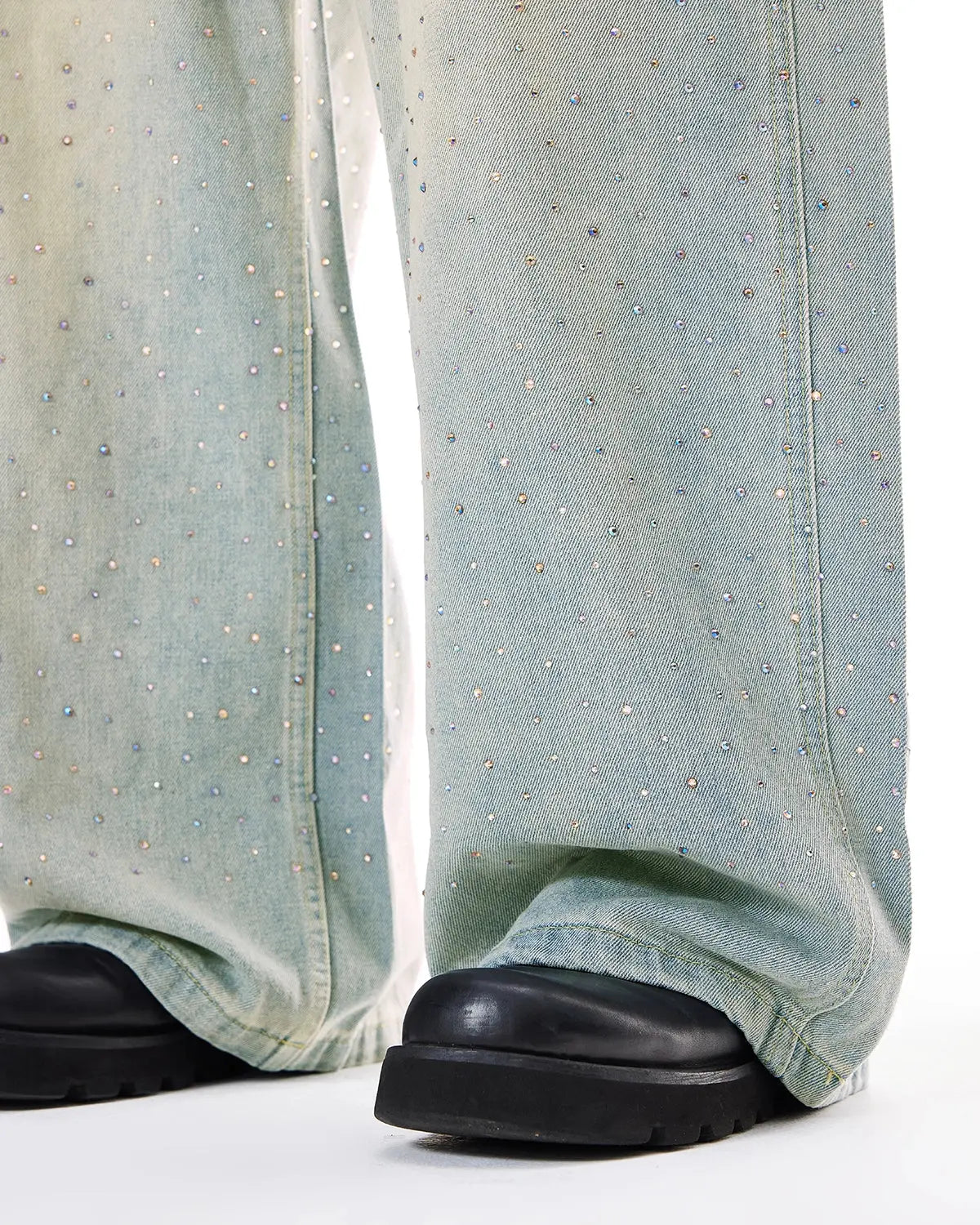 Washed rhinestone baggy jeans by INFLATION, streetwear pants with rhinestone details and relaxed fit, shown on a model.