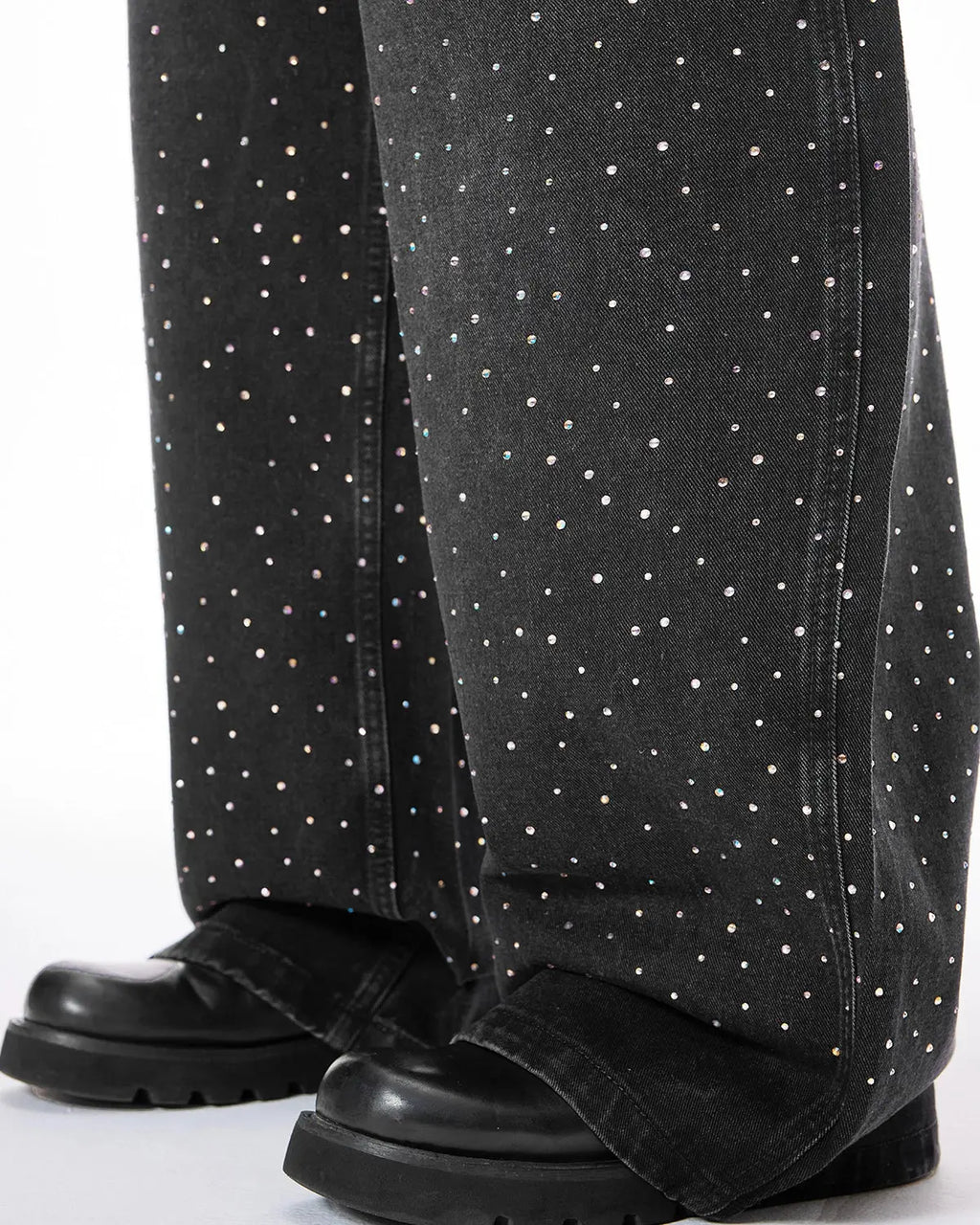 Acid washed rhinestone baggy jeans by INFLATION, featuring distressed fabric and rhinestone embellishments, casual streetwear style.