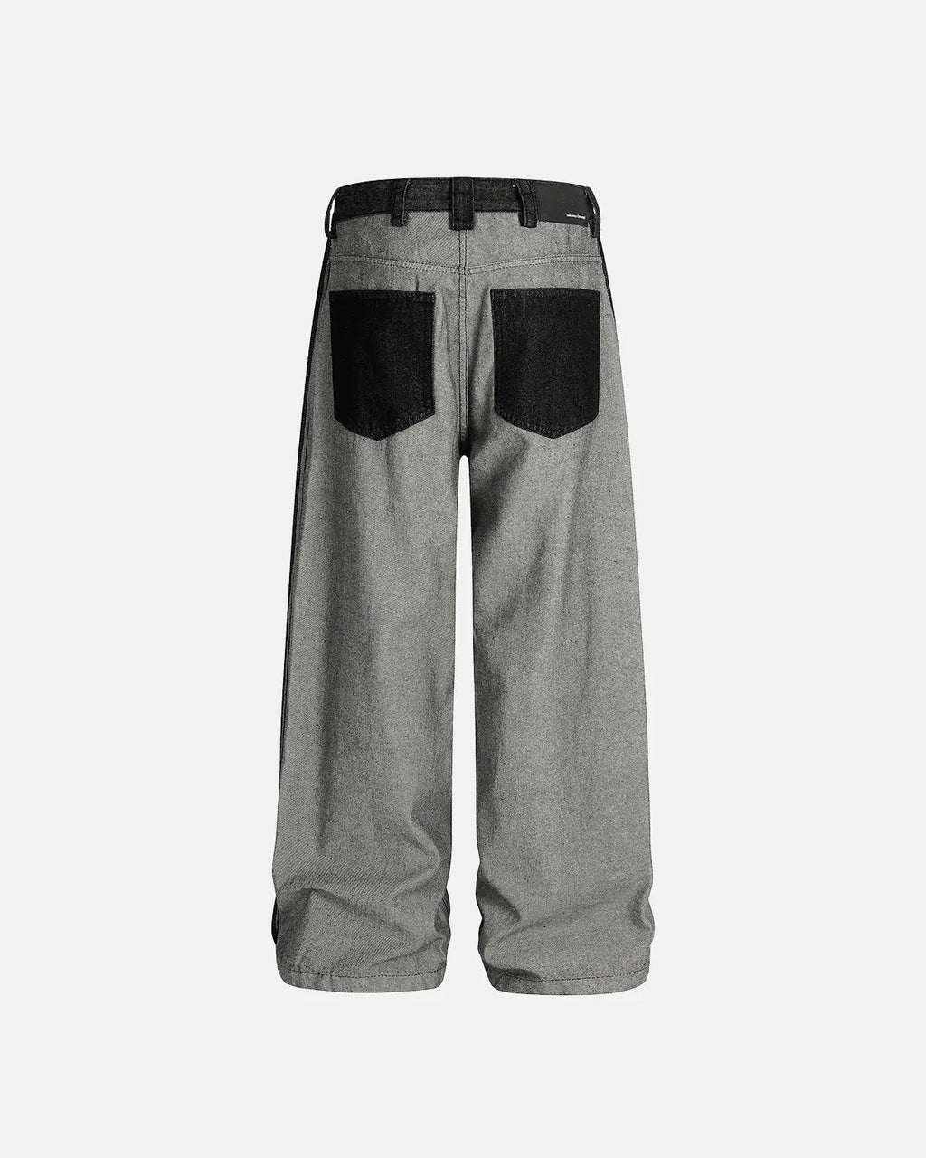 Distressed reverse design baggy jeans by INFLATION, featuring a loose fit, ripped details, and reverse-style distressing.
