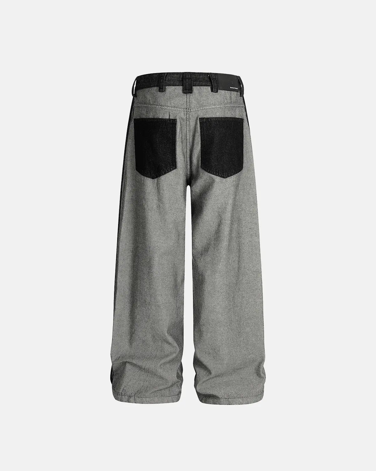 Distressed reverse design baggy jeans by INFLATION, featuring a loose fit, ripped details, and reverse-style distressing.