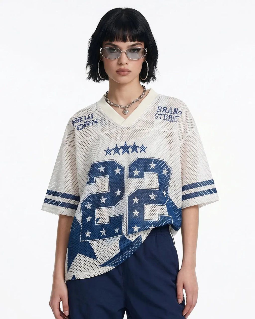 Star graphic oversized mesh jersey by INFLATION featuring a bold star design and breathable mesh fabric, perfect for streetwear style.