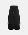 Washed distressed barrel sweatpants by INFLATION, showing relaxed fit, faded fabric, and distressed details on soft cotton material.
