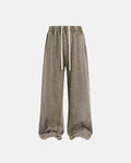 Inflation Streetwear straight leg acid wash sweatpants with relaxed fit and distressed denim style, shown on a model.