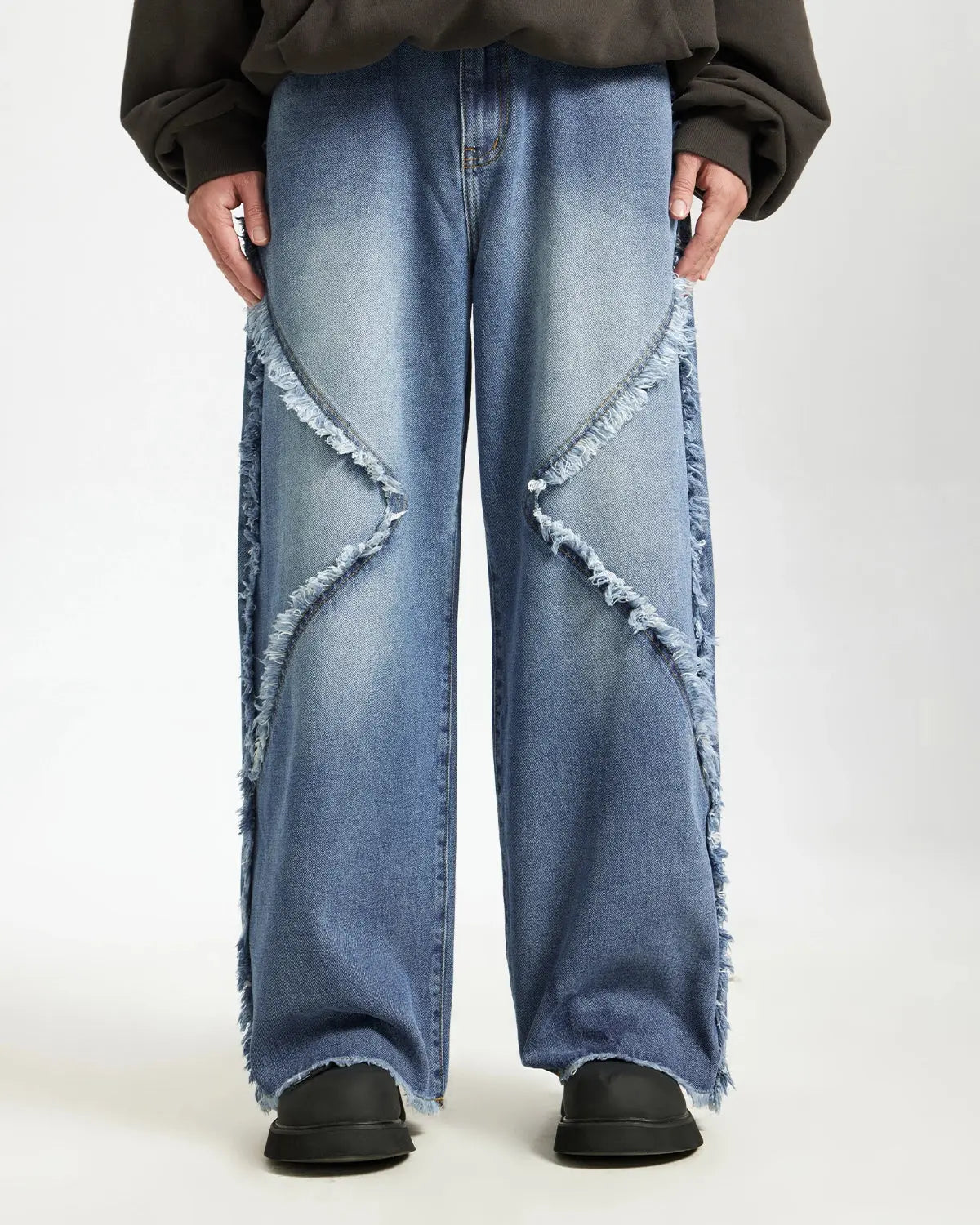 Blue frayed acid wash pants by INFLATION Streetwear featuring distressed denim and a relaxed fit.
