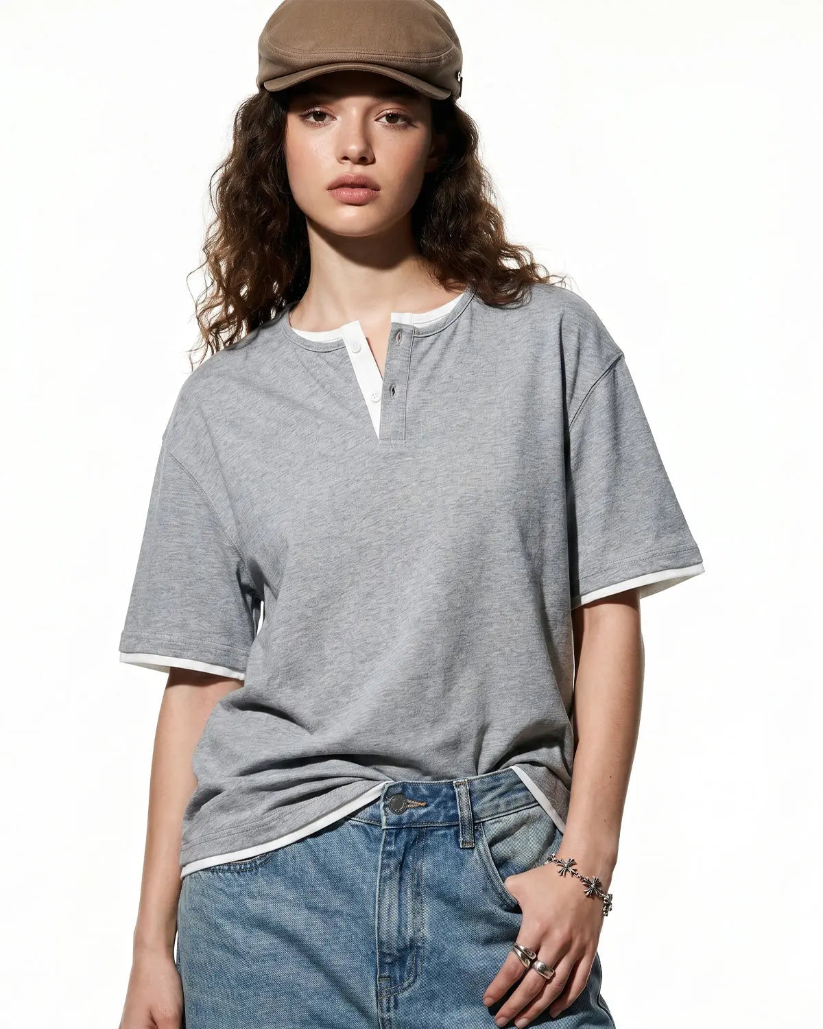 Old Money Layered Henley T-Shirt by INFLATION, casual men's shirt with layered design and buttoned neckline, in neutral tones.