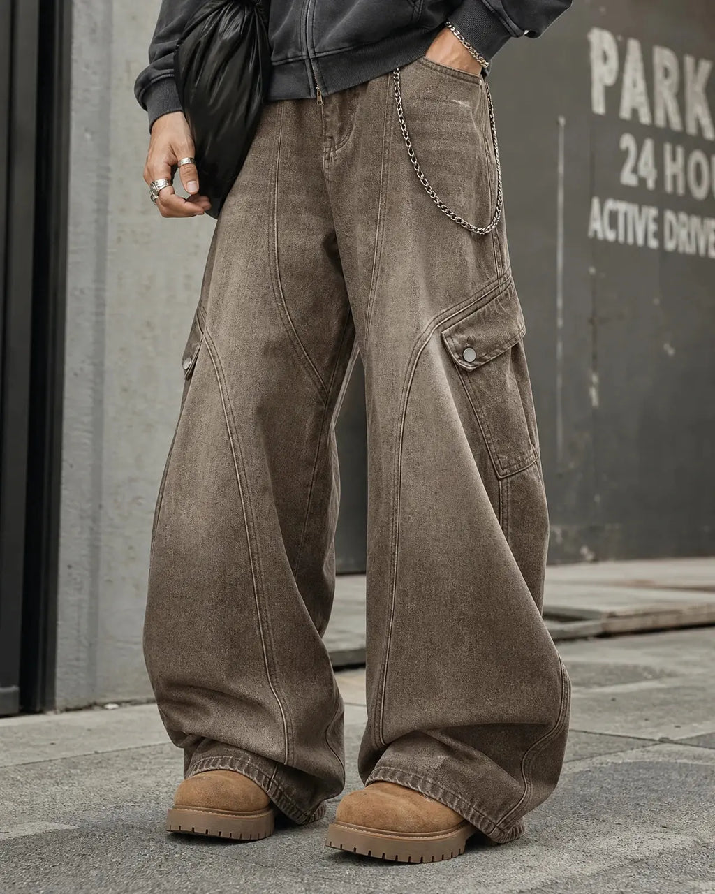 Inflation Brown Acid Wash Barrel Jeans with relaxed fit, showing the distressed acid wash denim and tapered leg style.