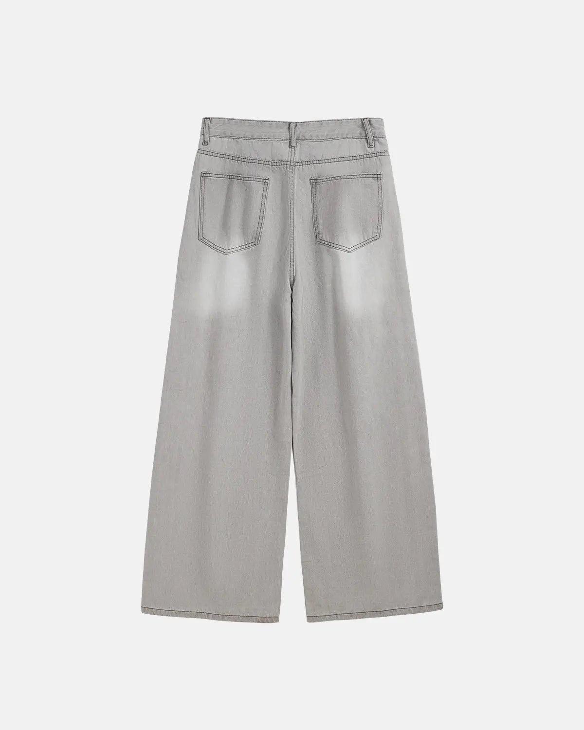 Washed distressed baggy jeans by INFLATION, featuring a relaxed fit, worn-out details, and streetwear style on a model.