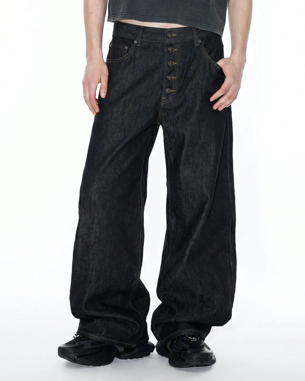 Inflation Streetwear Button Fly Raw Baggy Jeans with distressed denim and relaxed fit, styled with casual streetwear vibe.