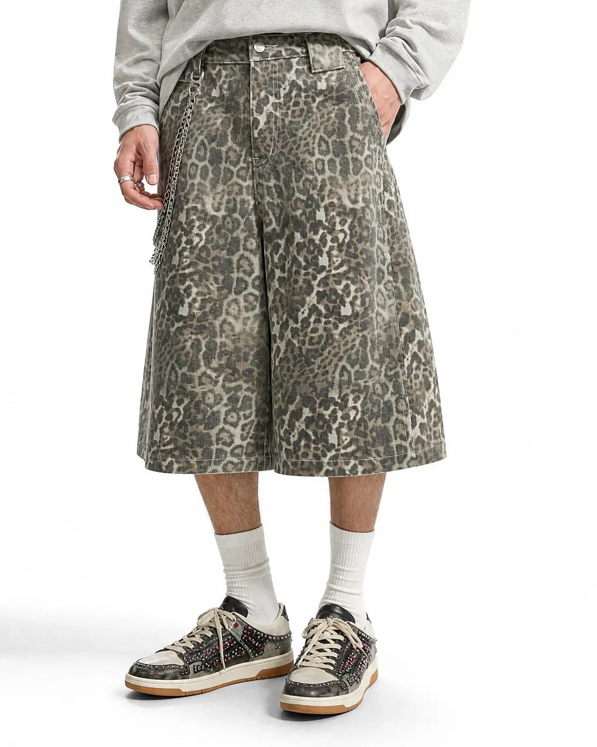 Leopard print baggy pants by INFLATION, streetwear style, featuring loose fit and bold animal print fabric.