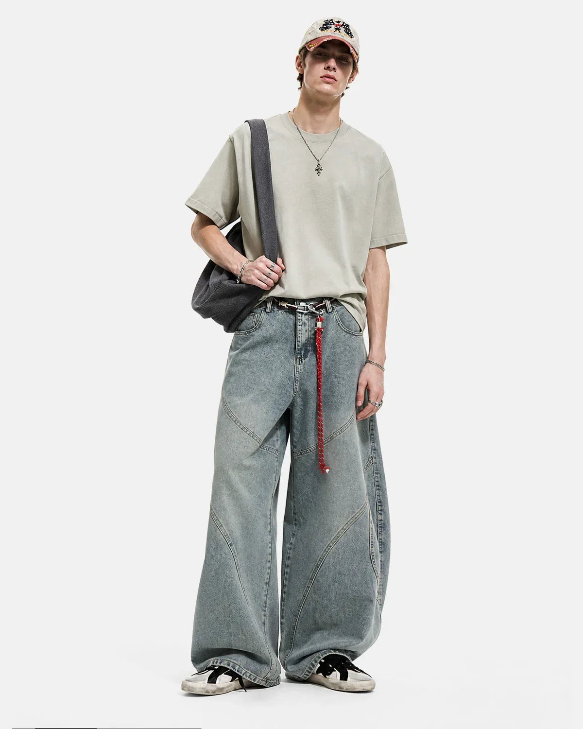 Acid wash baggy jeans with stitching from INFLATION Streetwear, featuring a relaxed fit and distressed denim style.