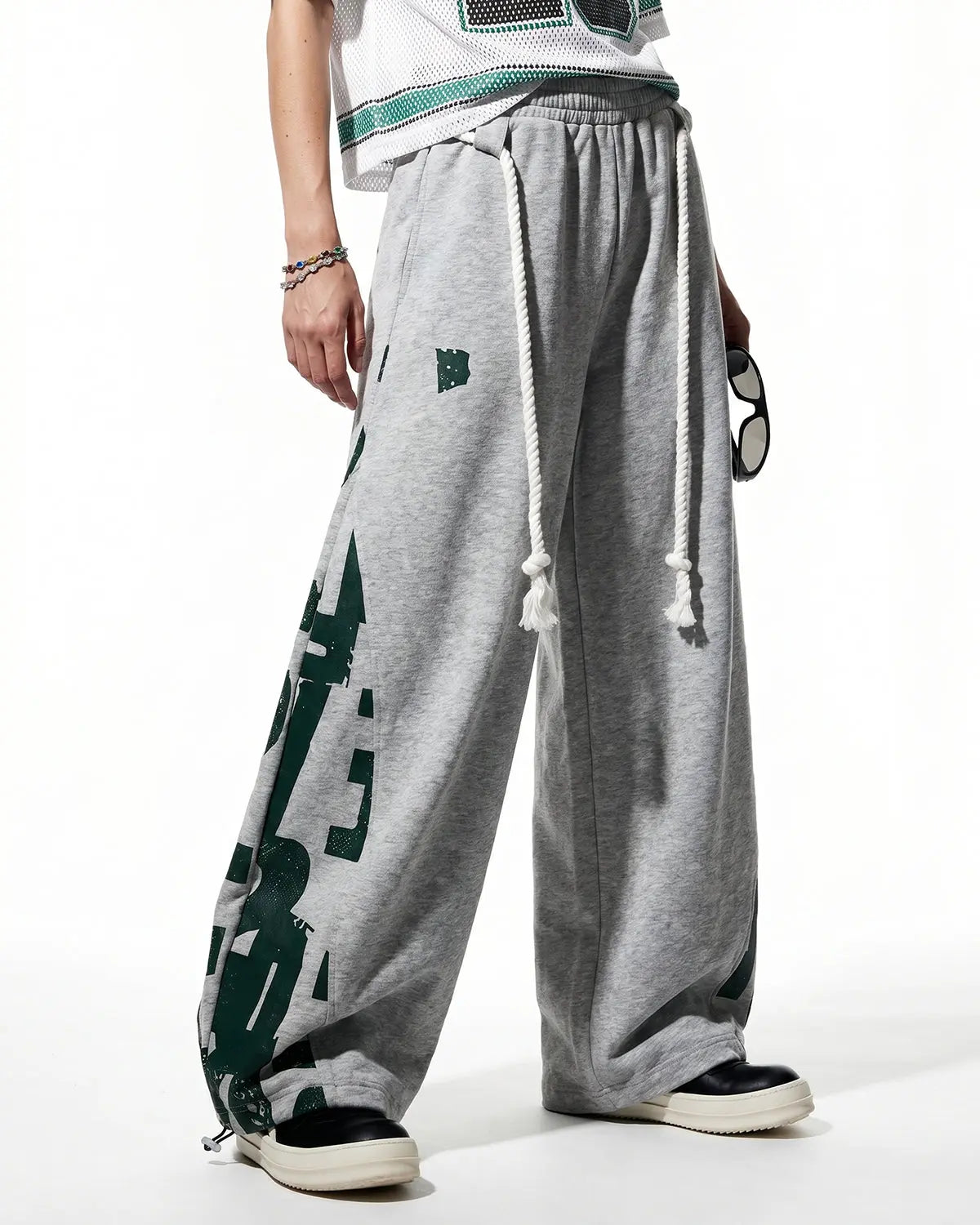 Inflation Streetwear graphic barrel sweatpants with bold design, comfortable fit, and tapered style, shown on a model.