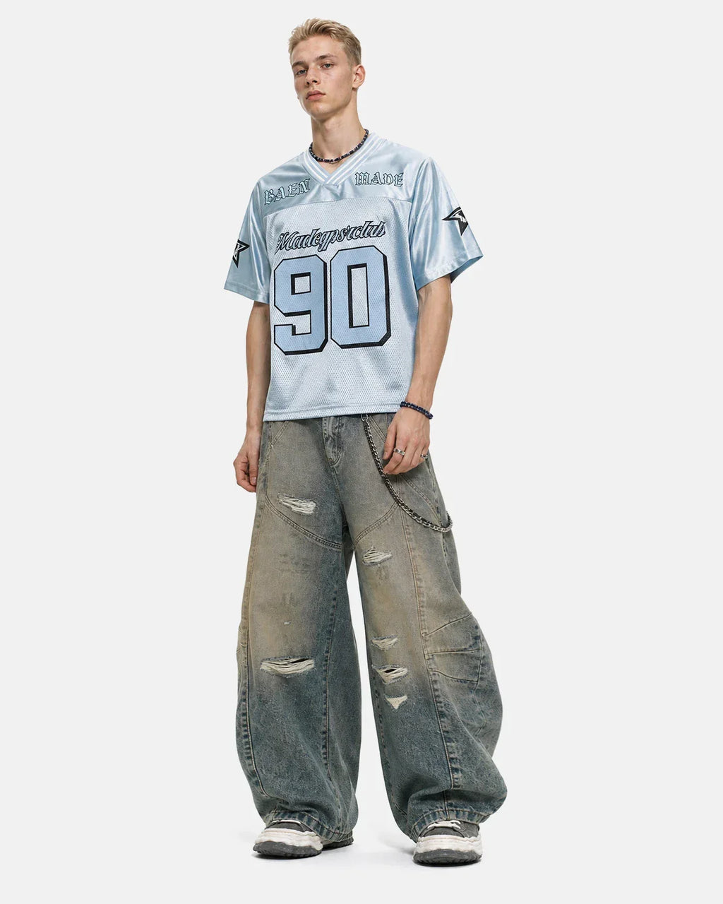 Distressed dirty wash barrel jeans by INFLATION, showcasing a rugged, faded denim design with distressed details and relaxed fit.
