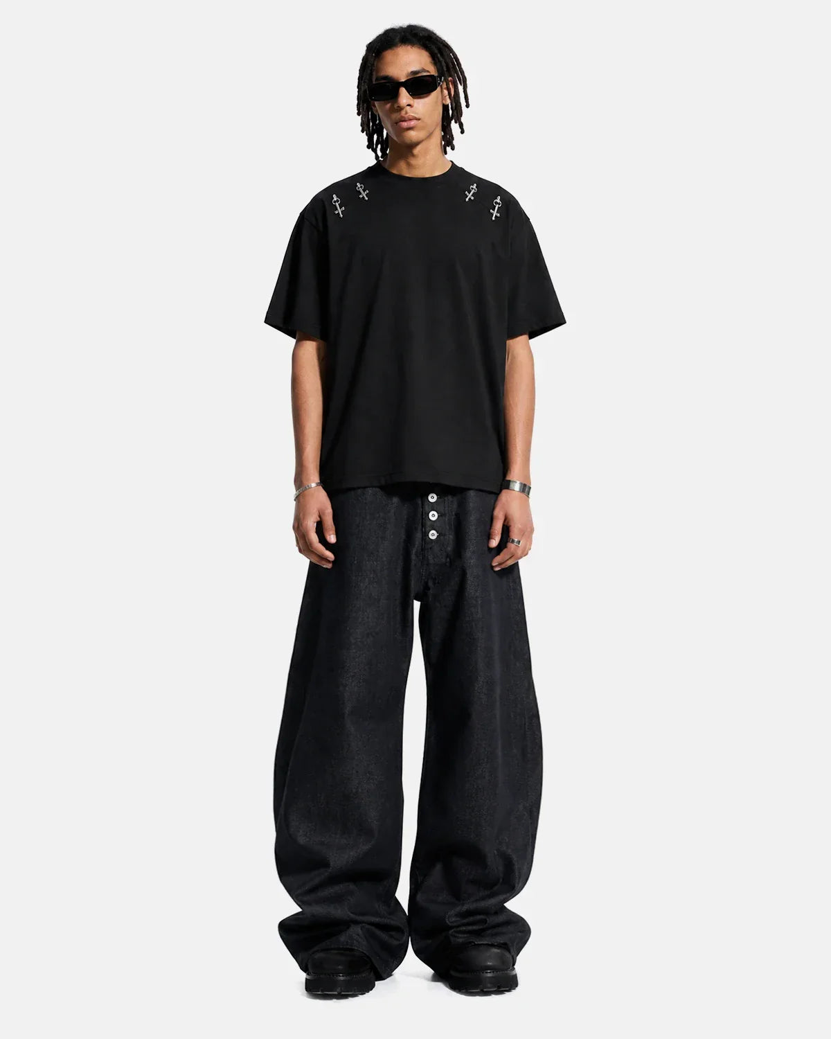 Inflation Streetwear Buttons Up Raw Baggy Jeans showing relaxed fit, button details, and raw hem design in denim fabric.