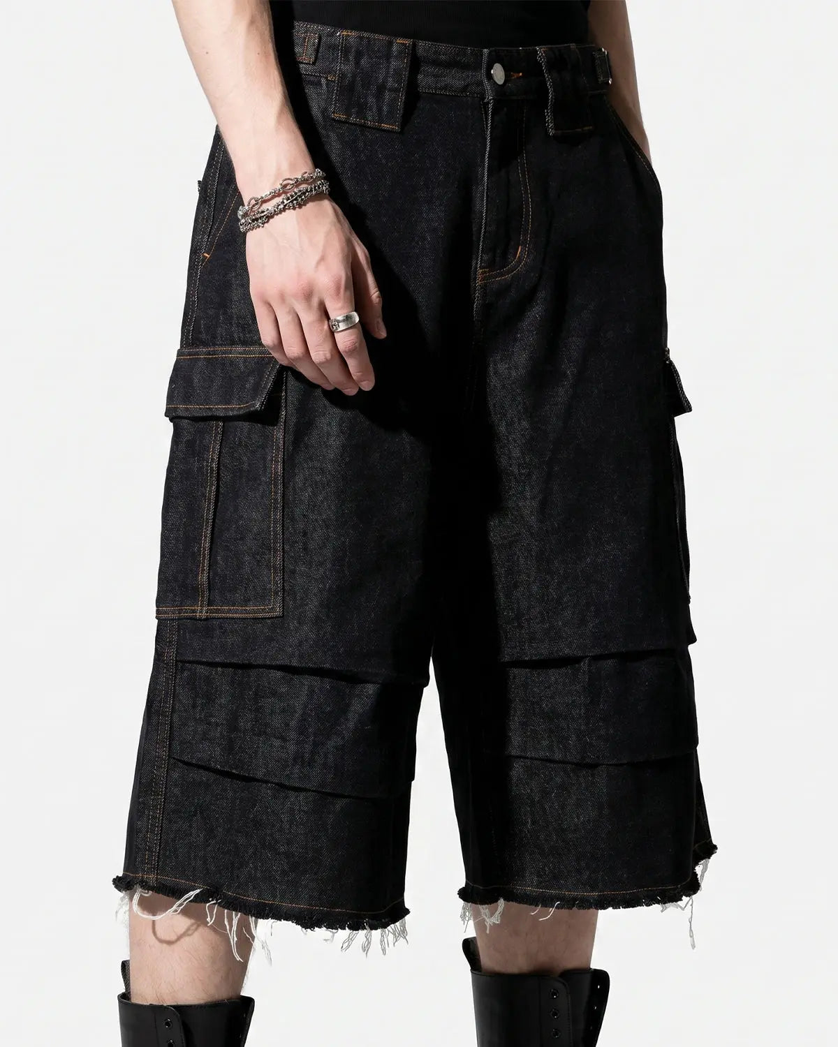 Inflation Streetwear layered utility baggy jorts, denim pants with multiple pockets and distressed details, casual street style.