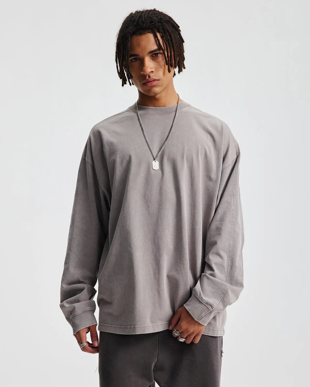 Inflation oversized distressed acid wash long sleeve T-shirt with a relaxed fit and edgy style, featuring a faded, worn-in look.