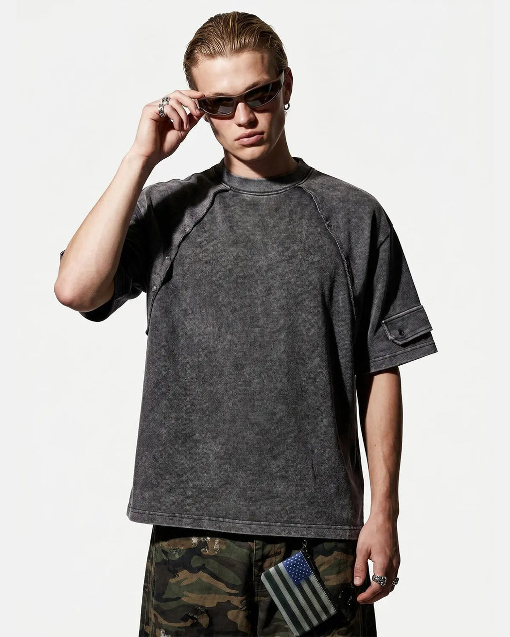 Deconstructed washed oversized T-shirt by INFLATION, featuring a relaxed fit and distressed details, displayed on a flat lay.