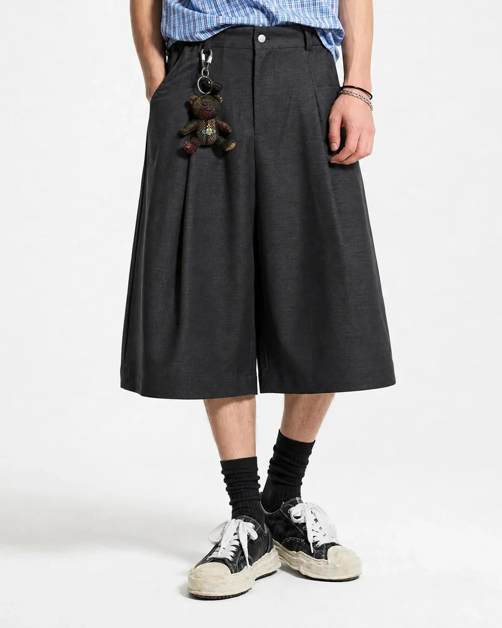 Inflation Streetwear pleated wide-leg tailored shorts in beige fabric, featuring high waist and relaxed fit for casual style.