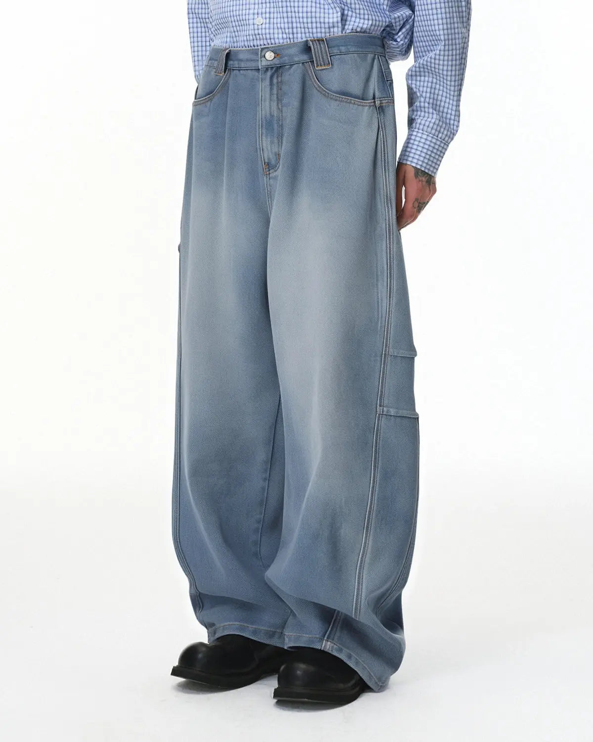 Distressed baggy cargo jeans by Inflation Streetwear featuring a relaxed fit, ripped details, and multiple cargo pockets.