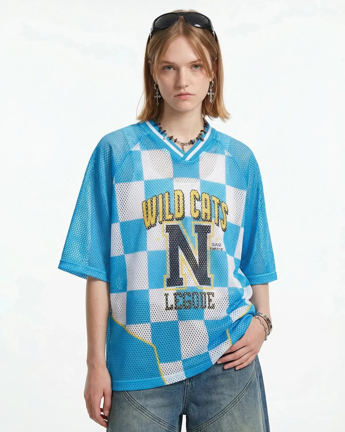 Inflation Streetwear varsity checkerboard mesh jersey featuring black and white checkerboard pattern and athletic fit.