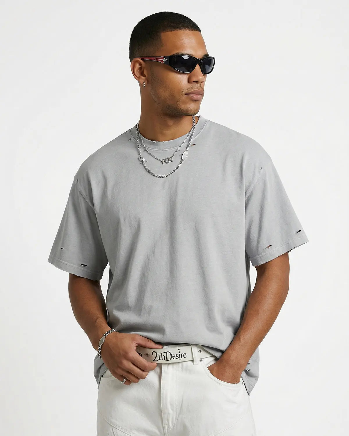 Inflation Streetwear ripped distressed washed oversized T-shirt with frayed edges and faded fabric, casual streetwear style.