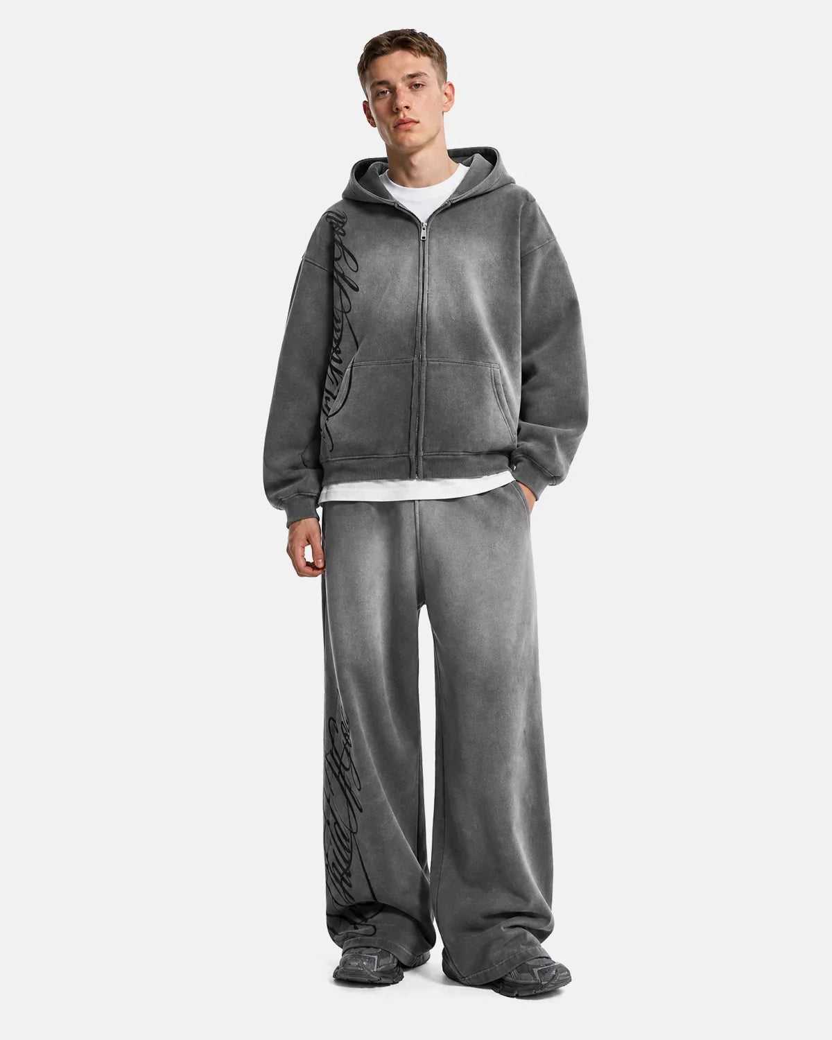 Acid washed INFLATION streetwear sweatpants with a relaxed fit, showcasing distressed denim-style fabric and casual style.