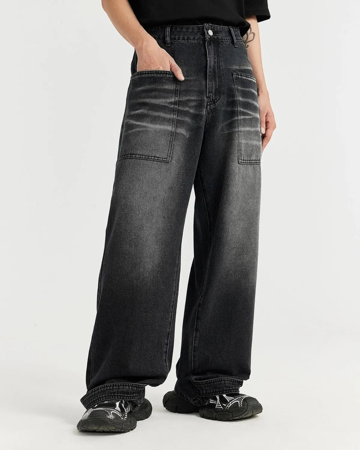 Black washed baggy jeans by INFLATION Streetwear featuring relaxed fit and distressed denim for a casual, trendy look.