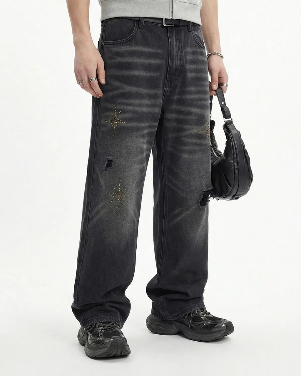 Distressed rhinestone ripped baggy jeans by INFLATION featuring rhinestone embellishments and a relaxed, oversized fit.