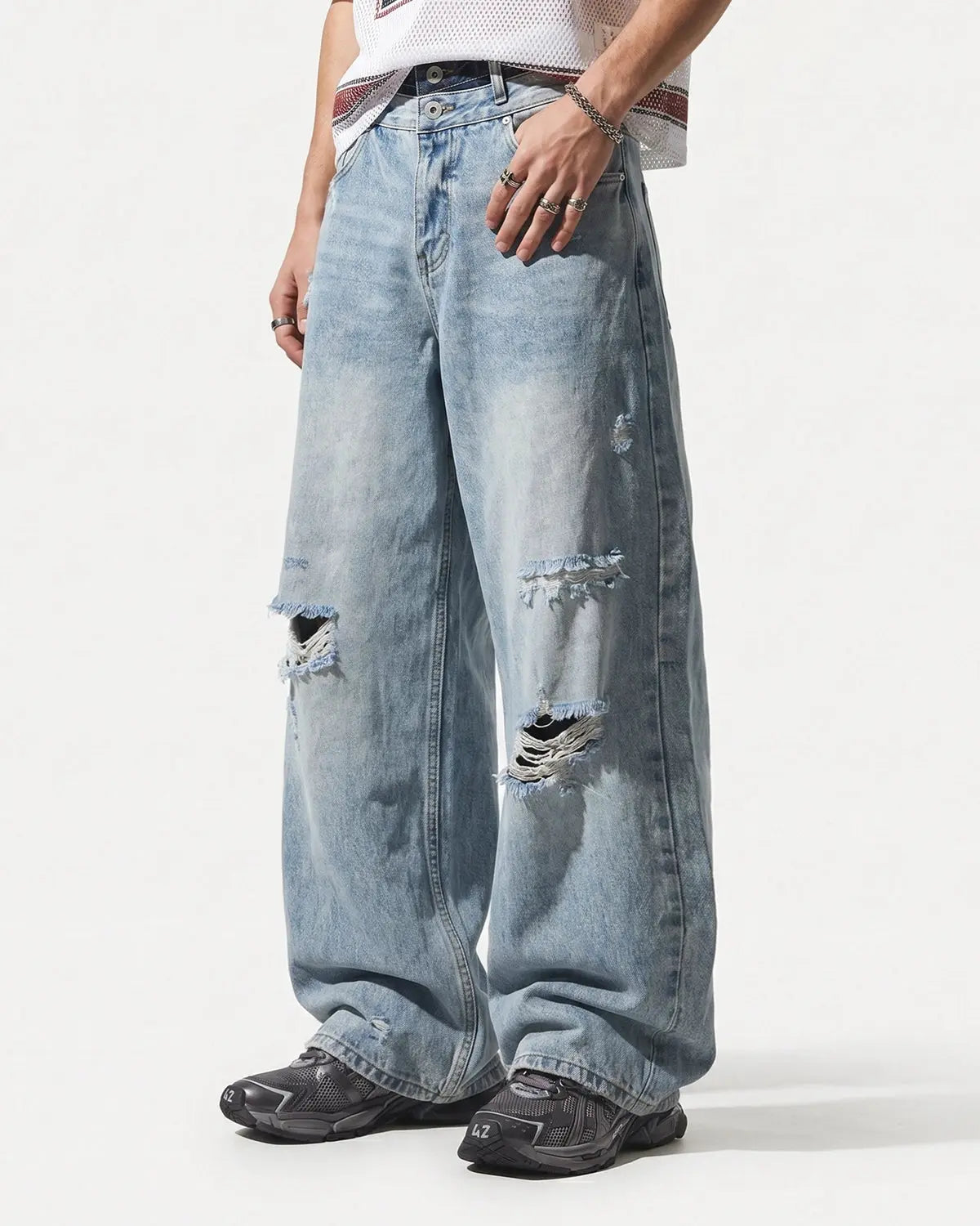 Inflation Double Waist Distressed Baggy Jeans with ripped details and relaxed fit, showcasing casual streetwear style.