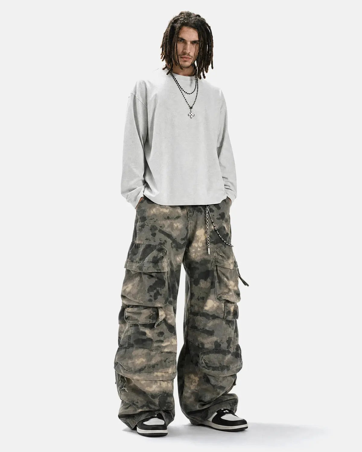Inflation Camo Multi-Pocket Baggy Cargo Pants with multiple pockets and loose fit in a camouflage pattern.