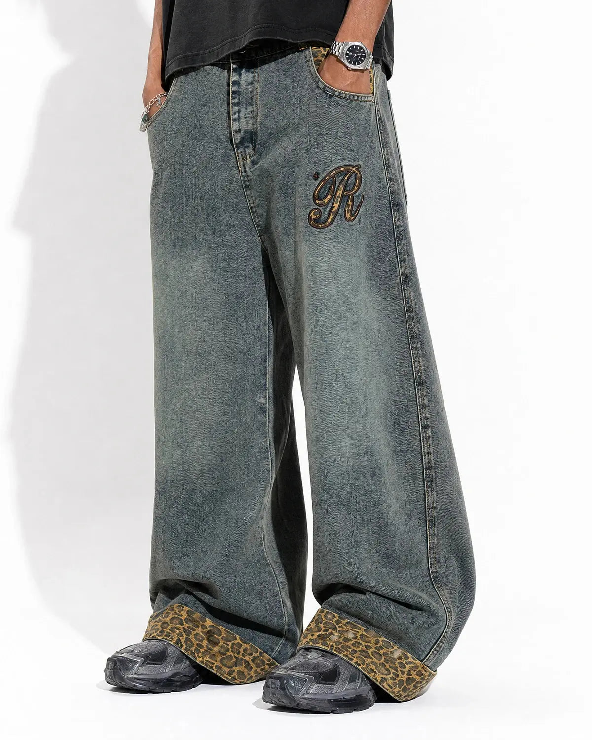 Leopard patchwork embroidery baggy jeans by Inflation Streetwear, featuring relaxed fit, distressed details, and bold animal print.