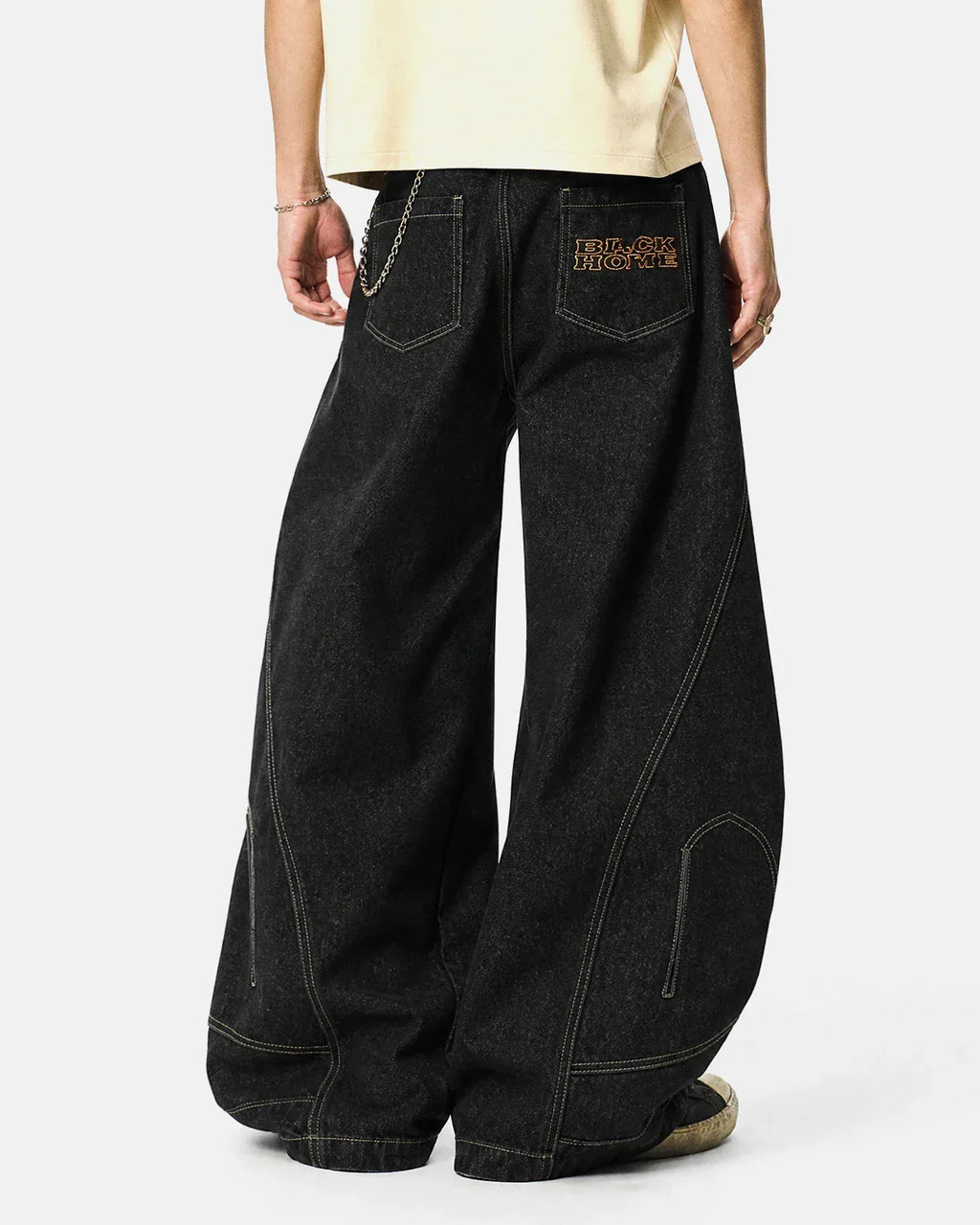 Raw Color Super Baggy Jeans by INFLATION featuring a loose fit, distressed denim, and raw hems, styled with casual streetwear.