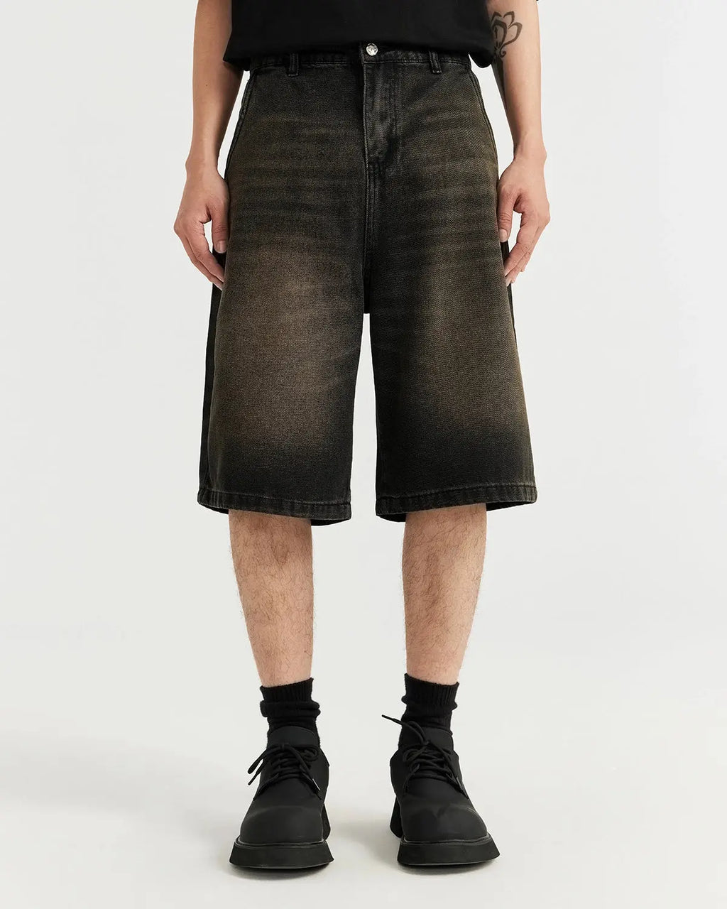Retro washed jorts by INFLATION featuring distressed denim and a casual streetwear style, shown in a relaxed fit.