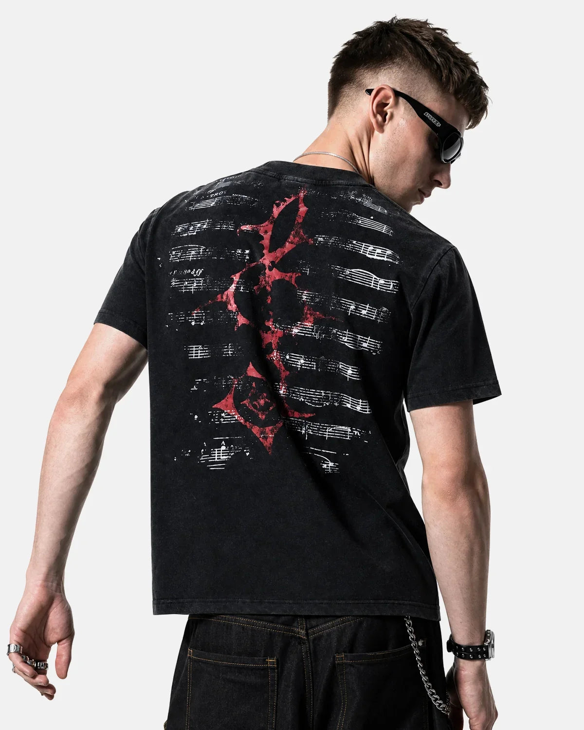 Acid washed music graphic T-shirt by INFLATION showing a vintage-style band design on soft cotton fabric.