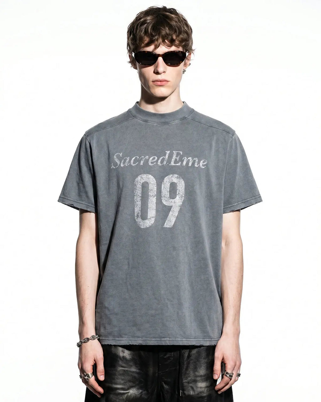 Distressed spray wash graphic T-shirt by INFLATION featuring a faded, vintage-style streetwear design on soft cotton fabric.