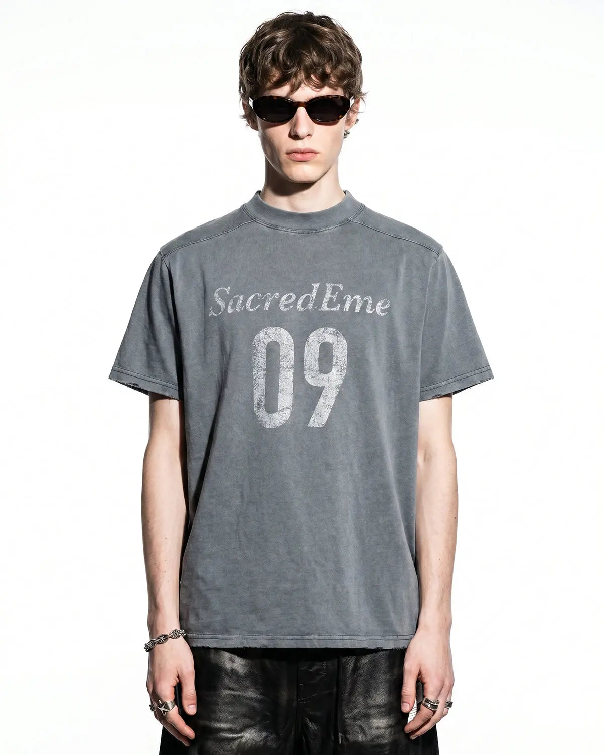 Distressed spray wash graphic T-shirt by INFLATION featuring a faded, vintage-style streetwear design on soft cotton fabric.