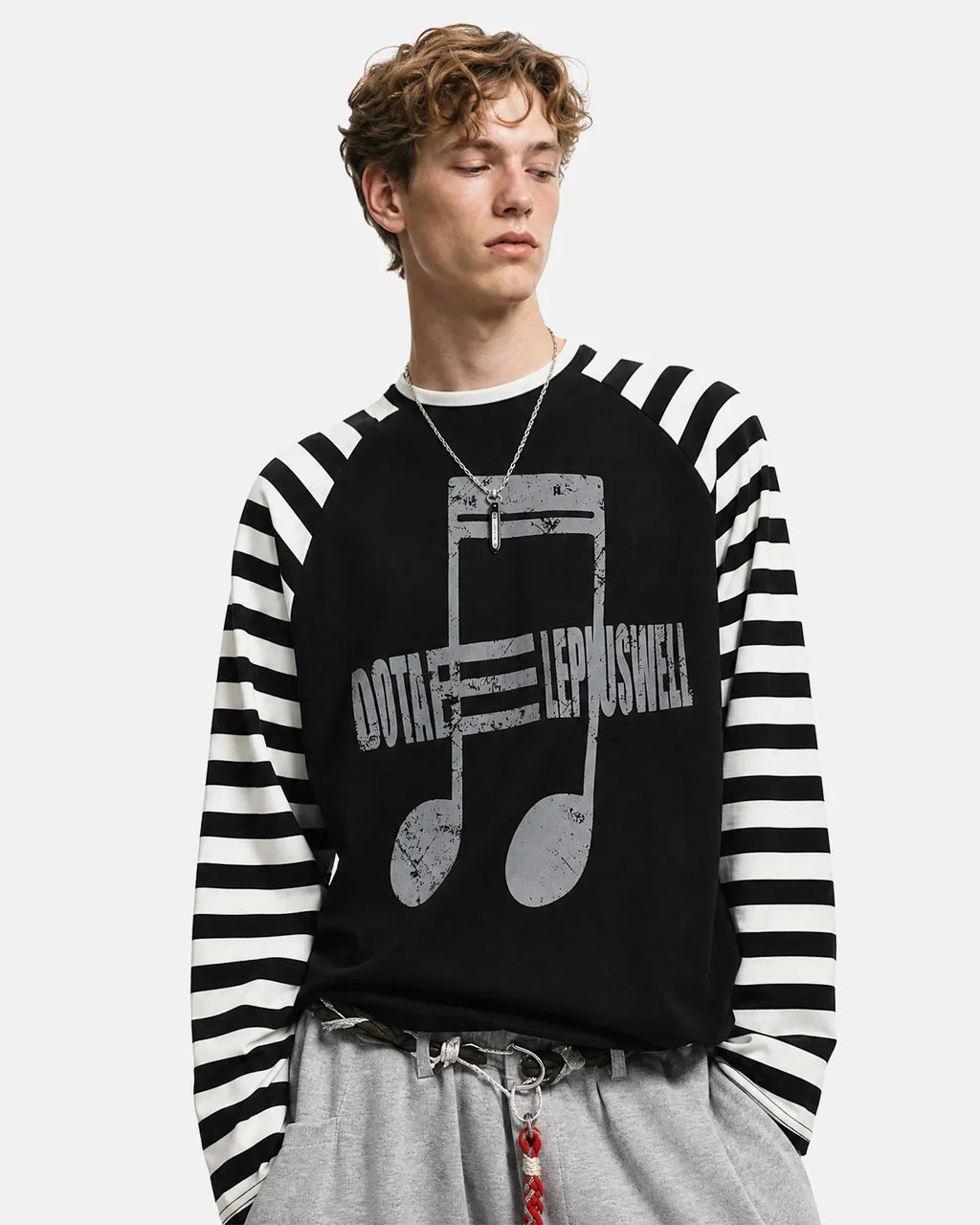 Inflation Streetwear music graphic striped long sleeve T-shirt, casual fashion top with bold music-themed print and colorful stripes.