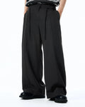 Inflation Cleanfit Baggy Suit Pants featuring a relaxed fit, black fabric, and modern streetwear style.