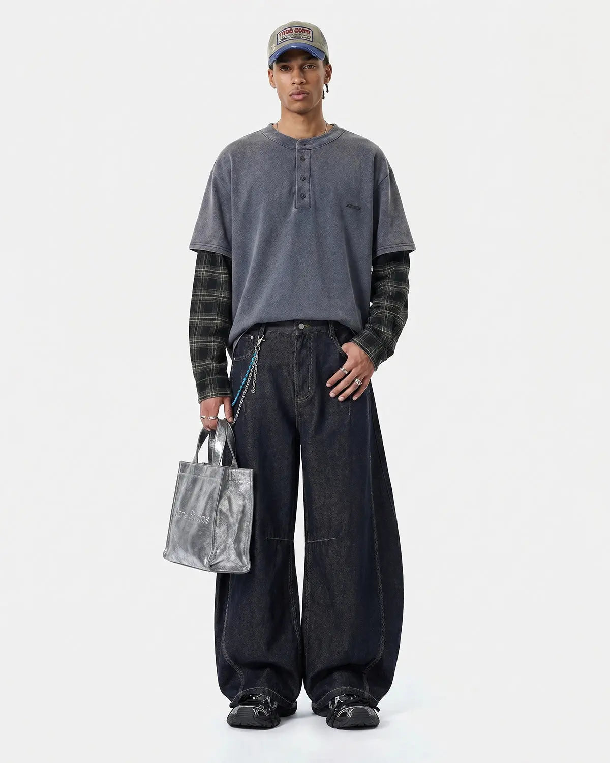Inflation Streetwear distressed plaid layered long sleeve tee with a rugged, casual style and layered design on neutral fabric.